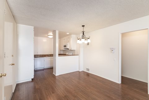 Dining Room with Hardwood Floors and Chandelier